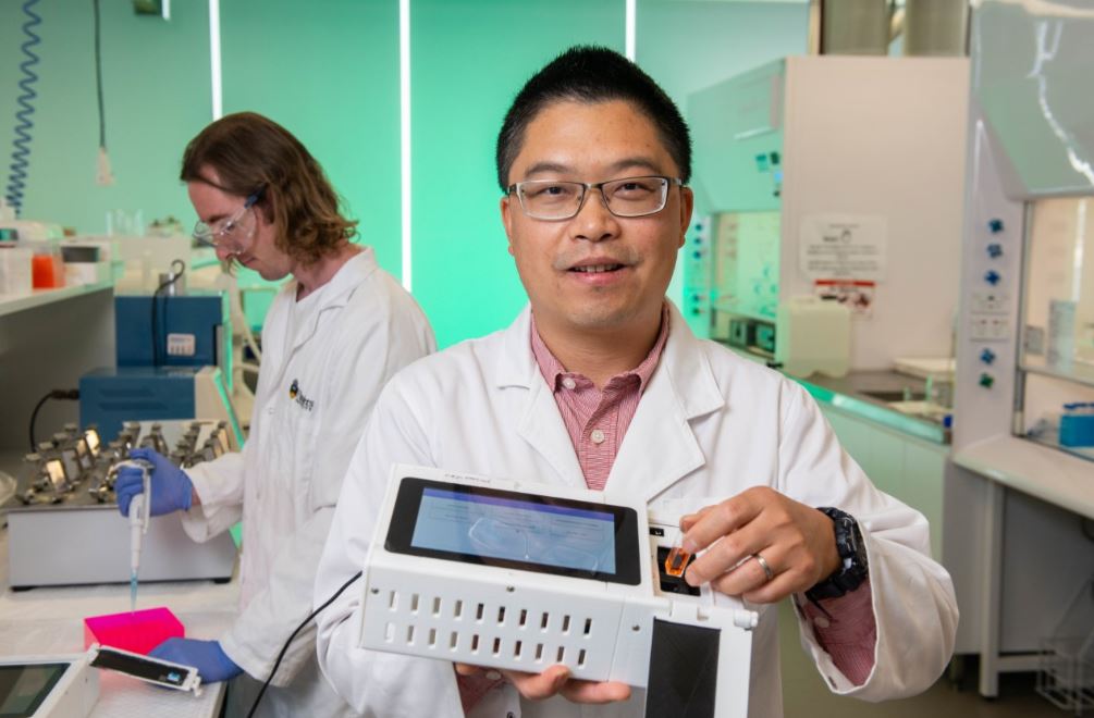 Professor Youhong Tang and the testing device at his laboratory at Flinders University, Tonsley Innovation Precinct.